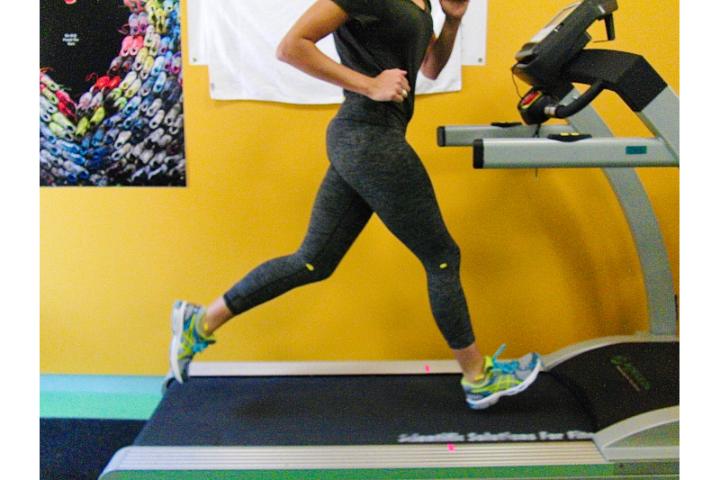 Woman runs on treadmill