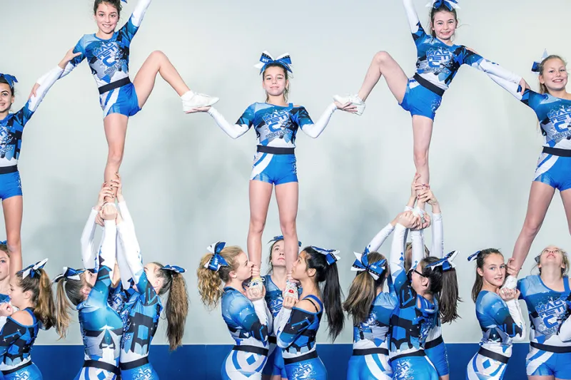 Cheerleaders pose for camera