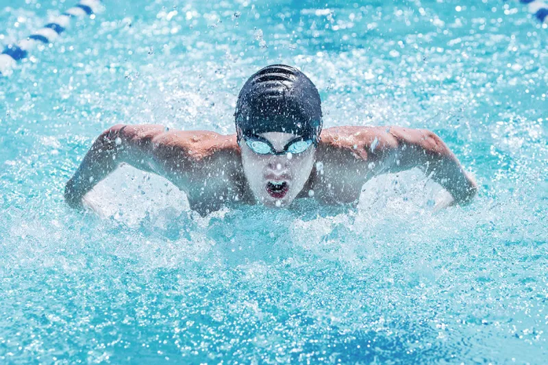 Swimmer moves through pool