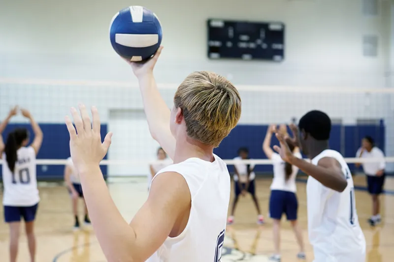 Player gets ready to serve during volleyball match