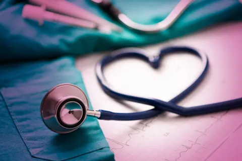 Stethoscope cord folded in the shape of a heart